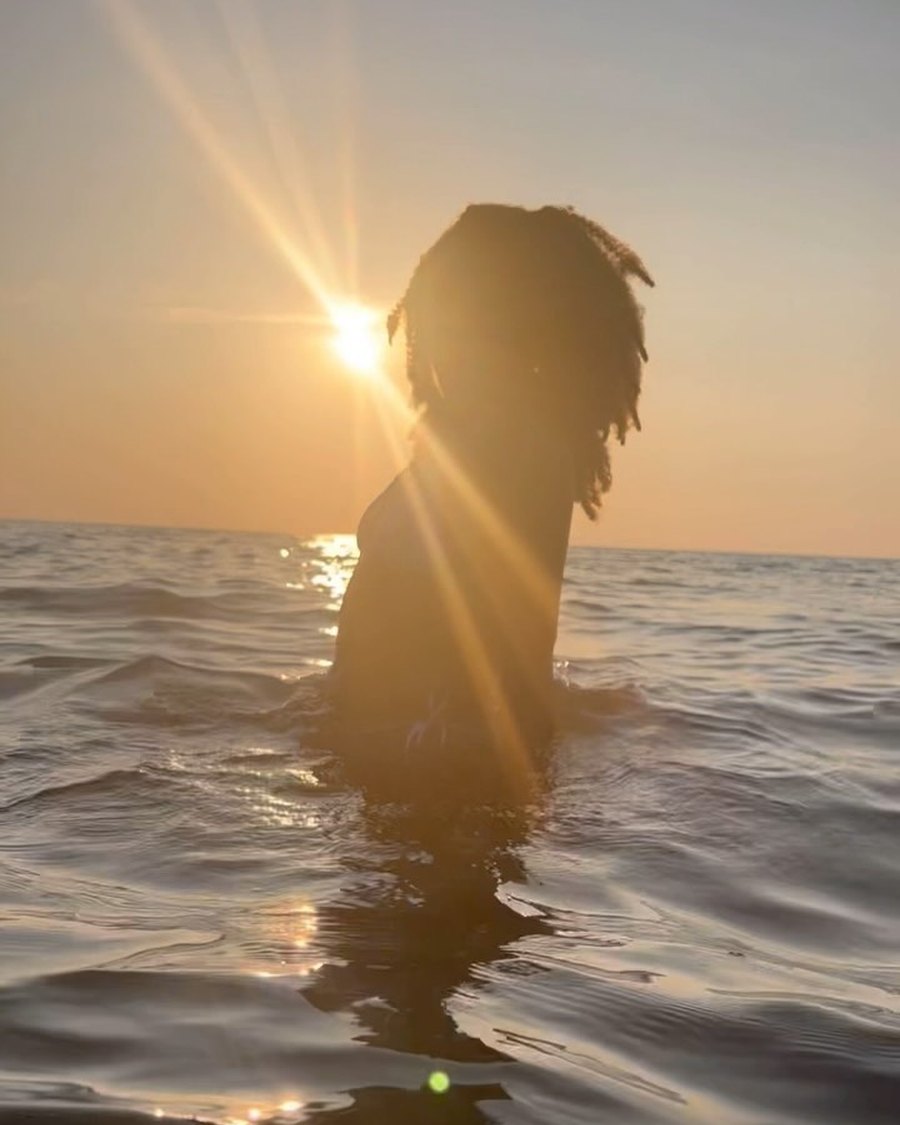 Ruqayyah in the sea at sunset
